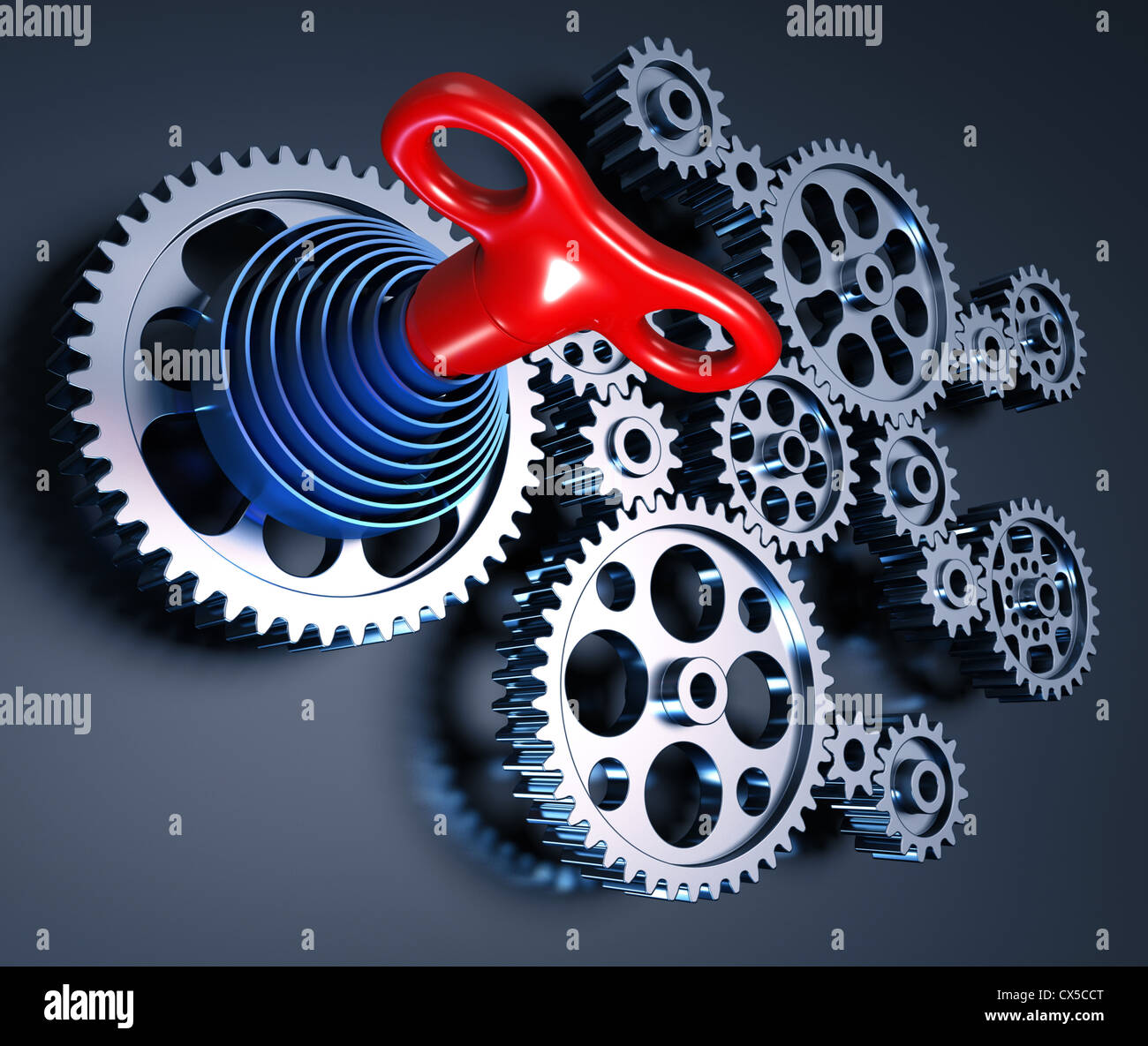 Set di ingranaggi interconnessi formando un concetto della macchina. La chiave e la primavera rappresenta l'inizio dell'operazione. Foto Stock