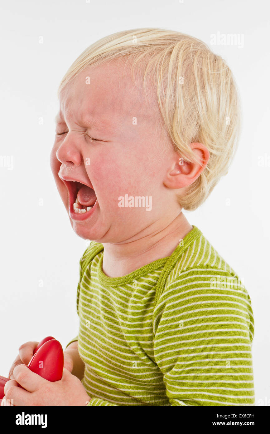 Un bambino piangere Foto Stock