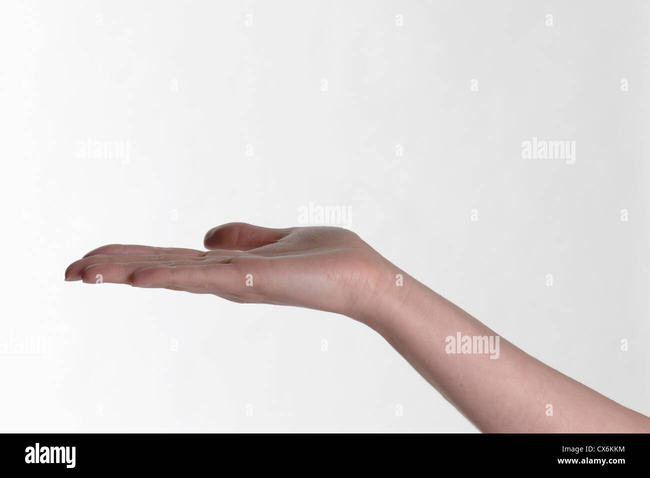 Una mano umana proteso palm fino Foto Stock