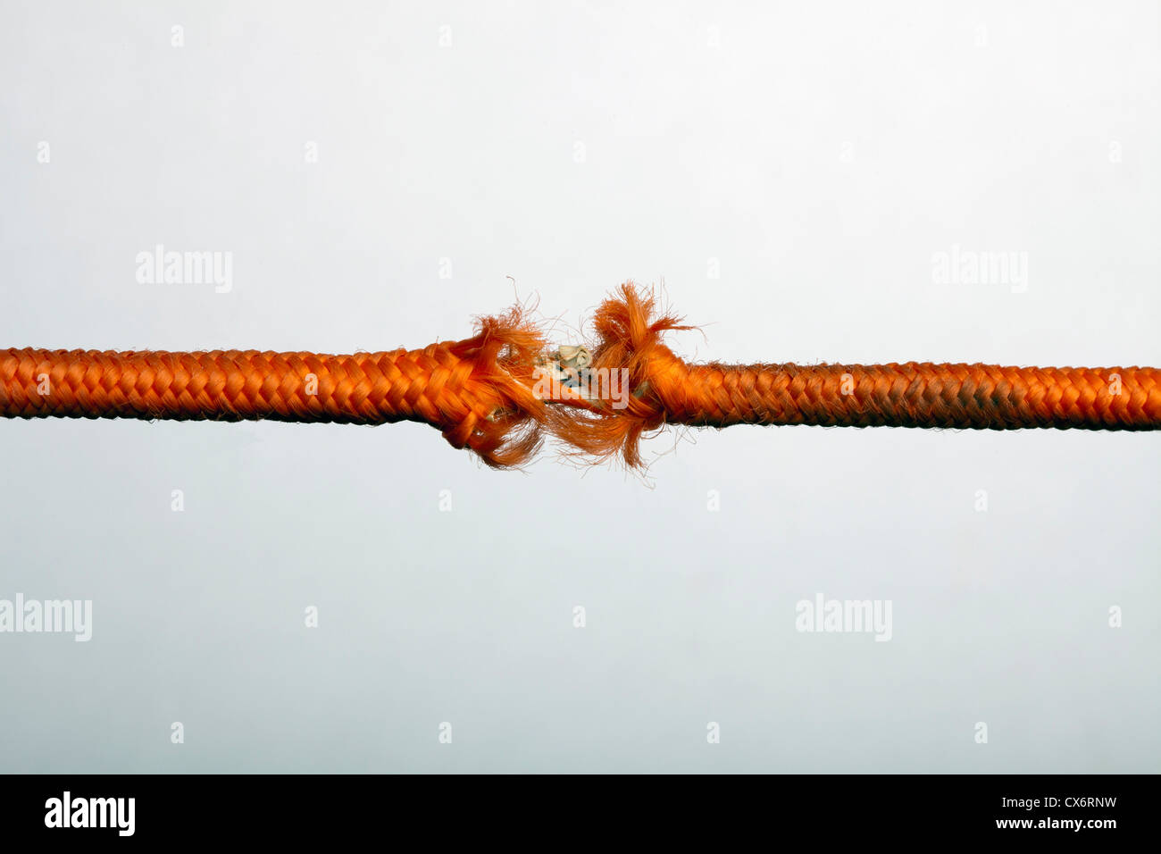 Una sfrangiatura corda arancione Foto Stock