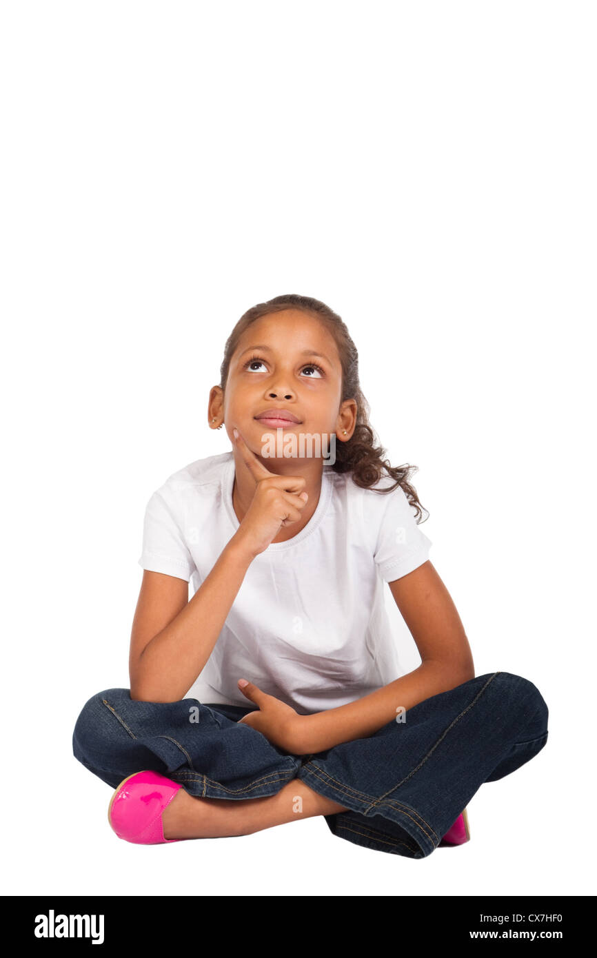 Giovani indiani ragazza seduta sul pavimento fantasticando Foto Stock