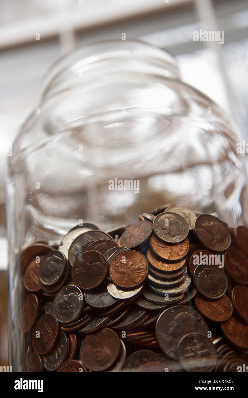 Vaso di denaro di noi monete Foto Stock