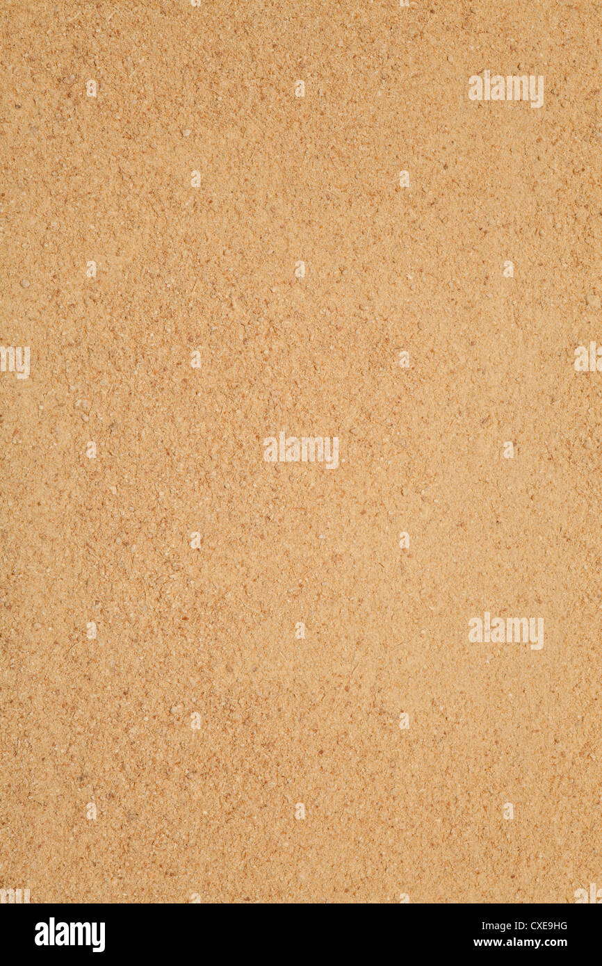 Lo zenzero in polvere, sfondo marrone, giallo food texture Foto Stock