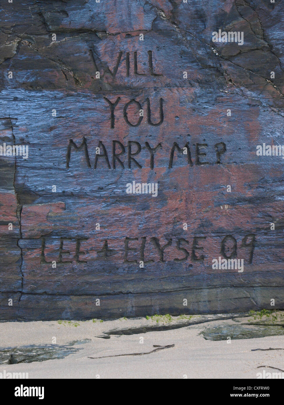 Ti sposerà me scavata nella roccia, Watergate Bay, Cornwall, Regno Unito Foto Stock
