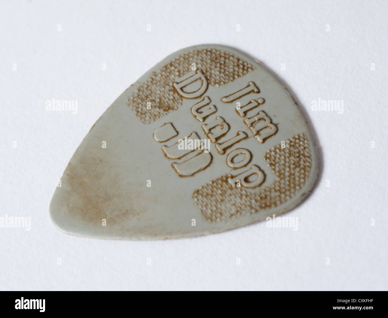 Una vista ravvicinata di una chitarra usurati pick Foto Stock