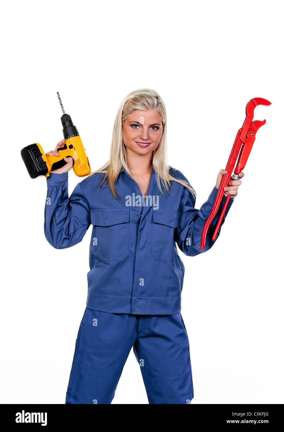 Donna in blu abiti da lavoro con un trapano Foto Stock