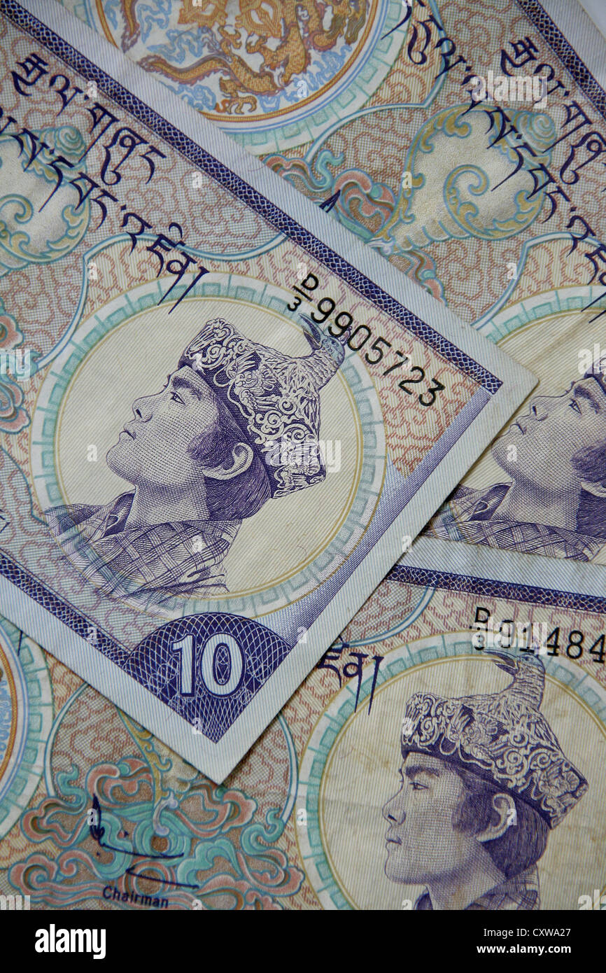 Banconota del Ngultrum bhutanese, la valuta ufficiale del Regno del Bhutan. Caratterizzato da intricate iconografie buddiste e schemi tradizionali. Foto Stock
