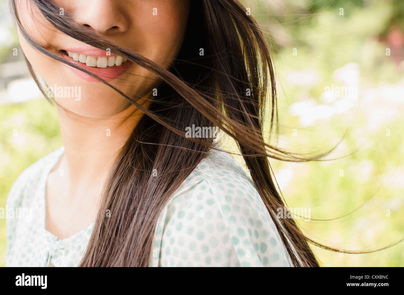 Sorridente donna asiatica Foto Stock