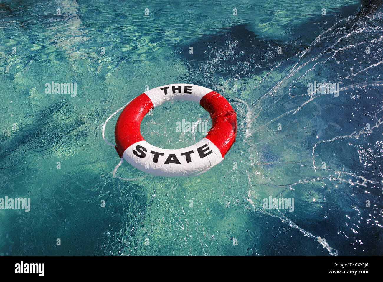 Anello di vita etichettati der Staat, Tedesco per la nazione, gettati in acqua e di immagine simbolica Foto Stock