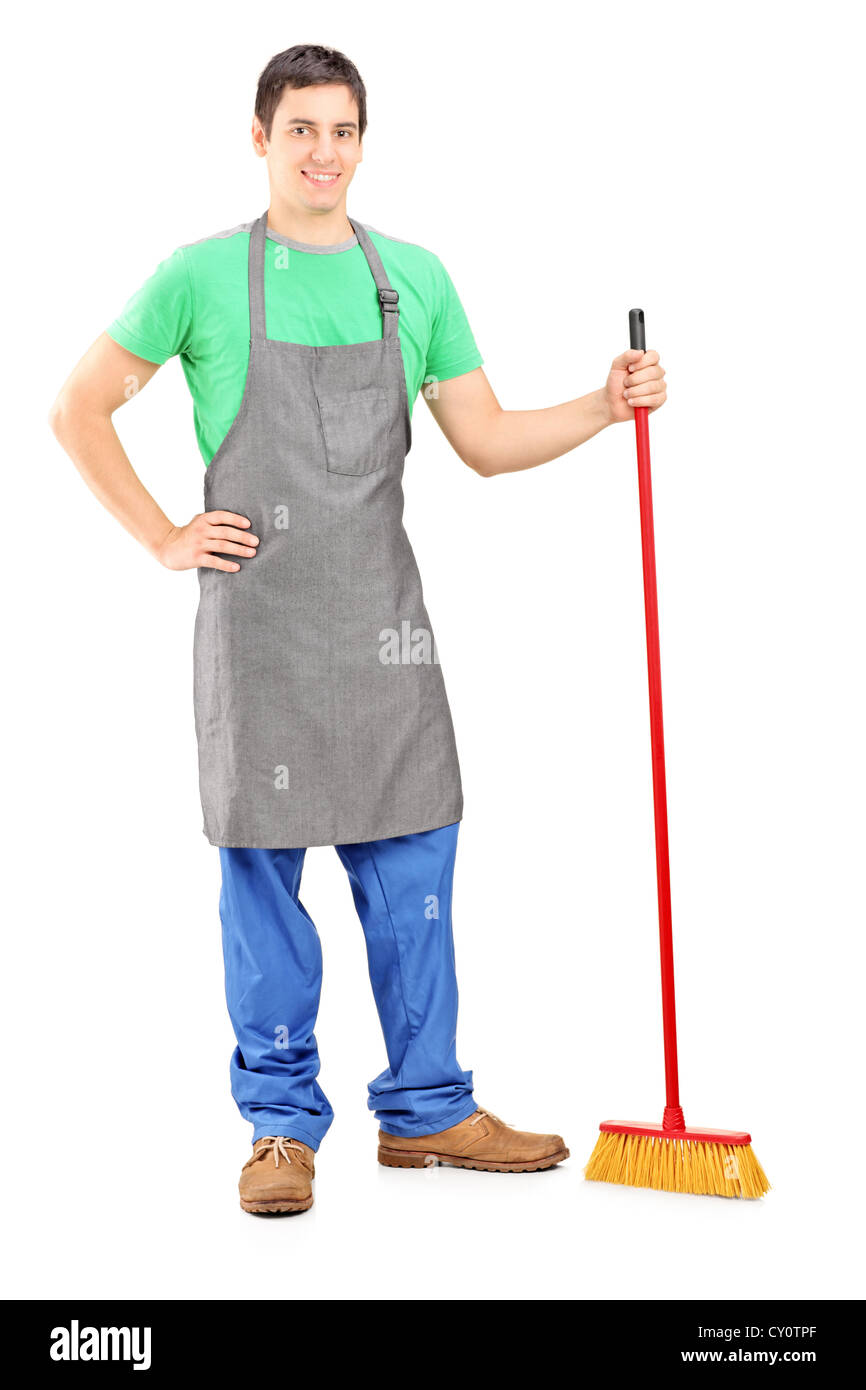 A piena lunghezza Ritratto di un uomo cleaner in posa con la spazzola nella sua mano isolati su sfondo bianco Foto Stock