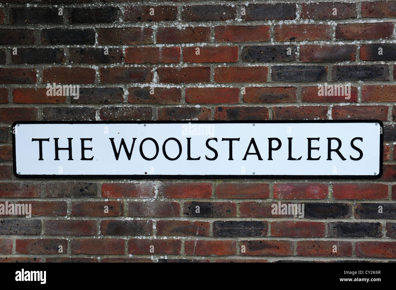 Sign in Chichester reminiscenza di Chichester lo status di città woolstaple. Foto Stock