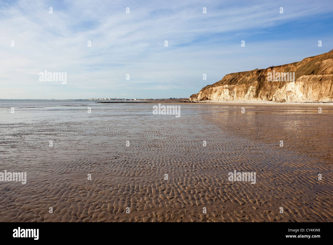 Una vista lungo l'increspata sabbia spiaggia di Dane's Dyke, a sud verso la città balneare di Bridlington su Yorkshire East coast Foto Stock