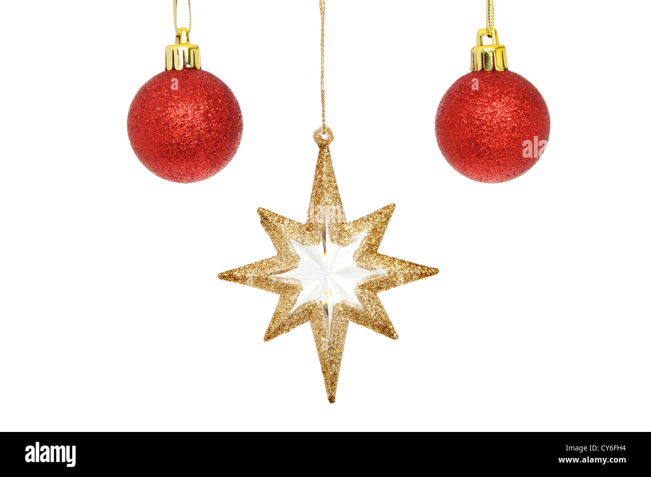 Oro glitter stella di Natale e baubles rosso isolata contro bianco Foto Stock