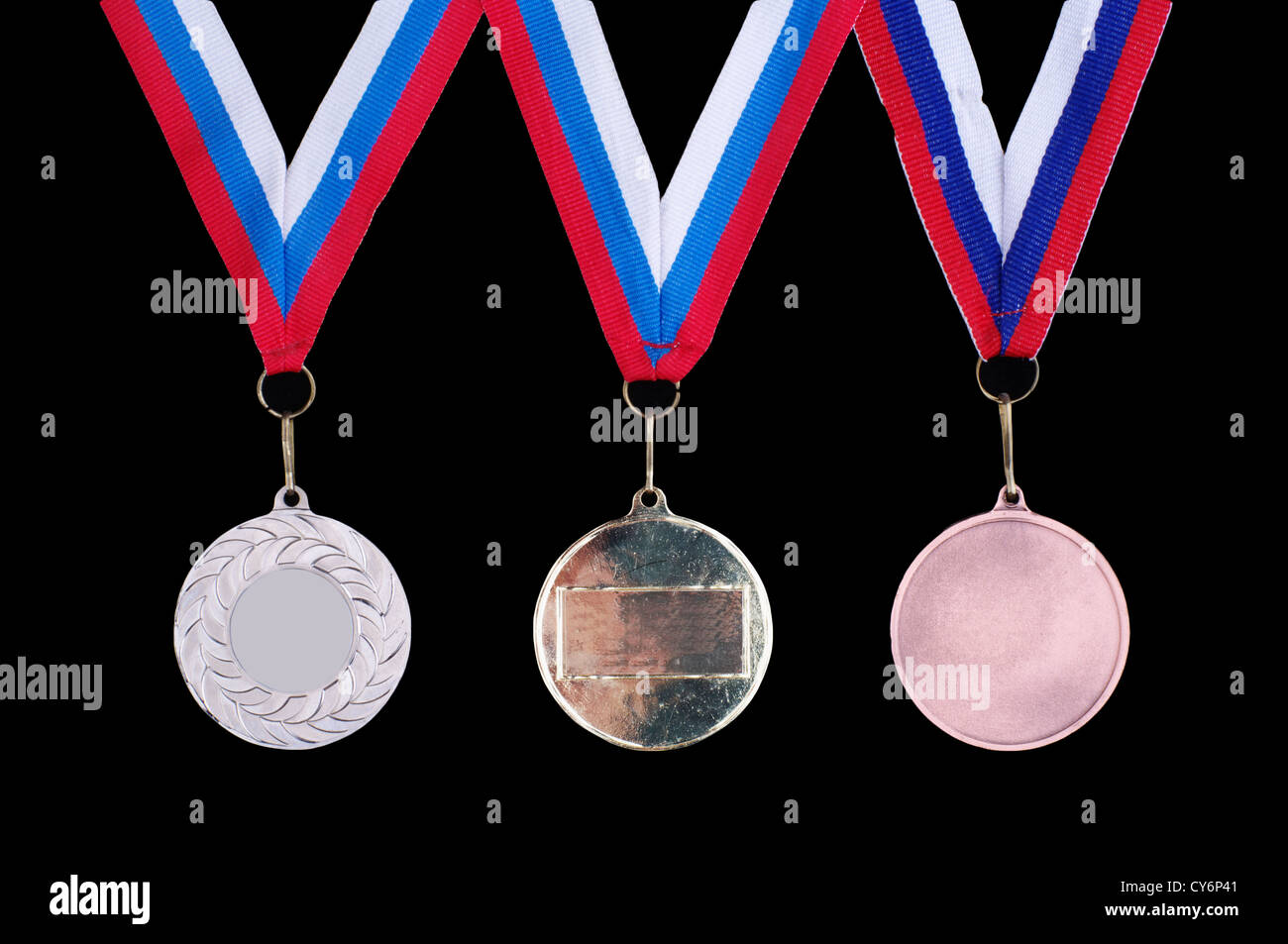 Oro, Argento E Medaglie Di Bronzo Per I Vincitori Con Il Nastro Rosso Stoc 112009395