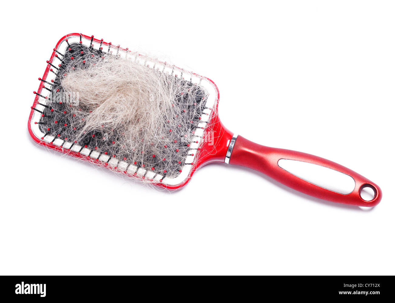 Spazzola per capelli rossi con un sacco di peli Foto Stock