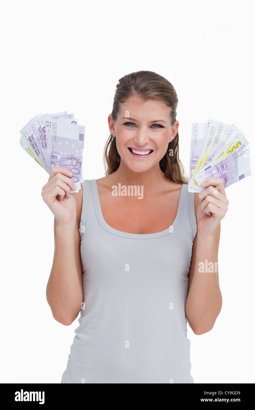 Ritratto di una donna che mostra di banconote Foto Stock