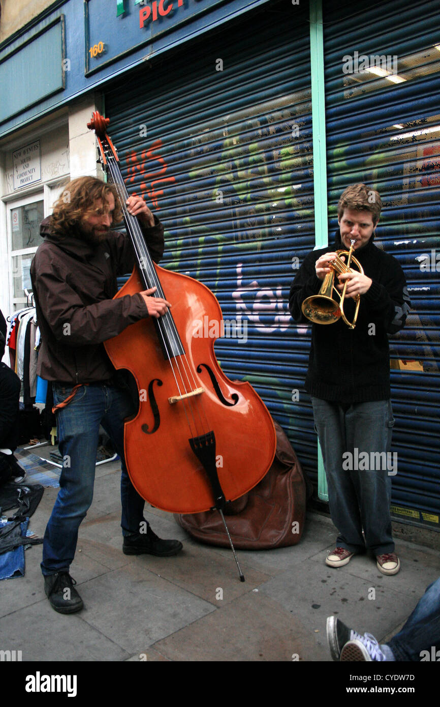 Street Buskers, Brick Lane, Londra Foto Stock