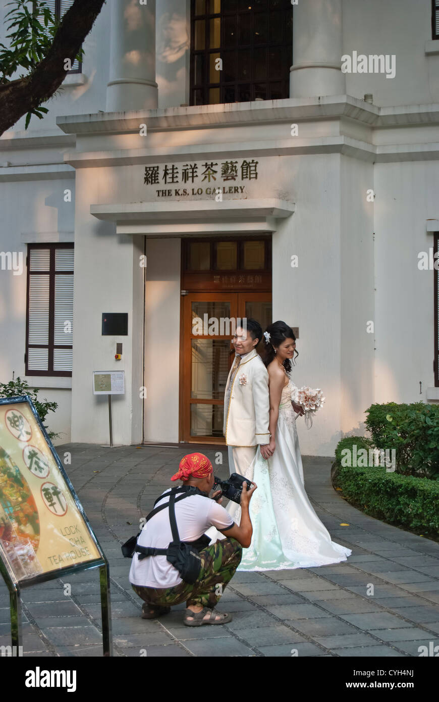 Coppie in viaggio di nozze e il fotografo Hong Kong Park Foto Stock