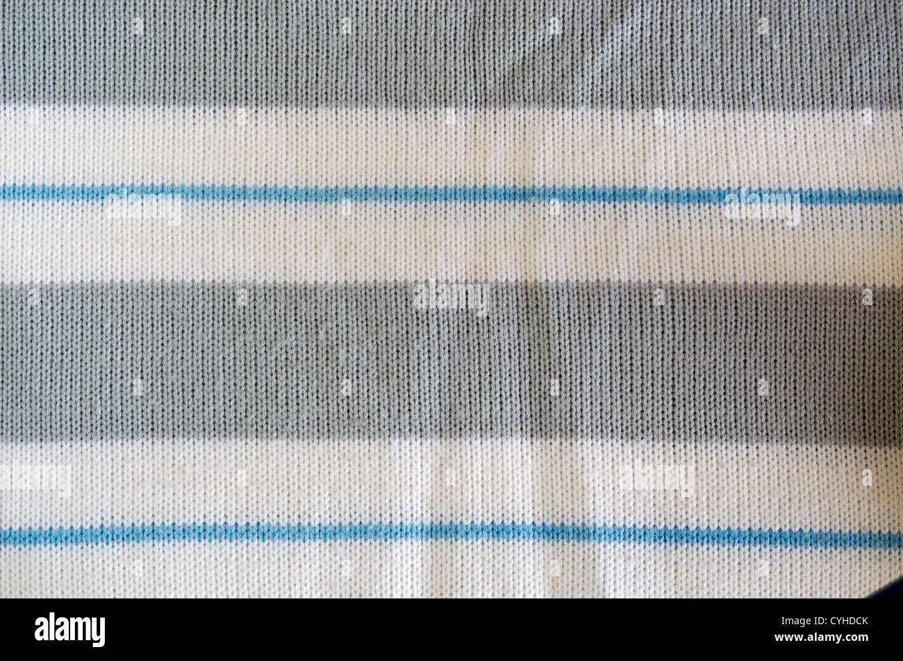 Maglia maglione di lana texture. Modello di tessuto blu grigio bianco colore di sfondo Foto Stock