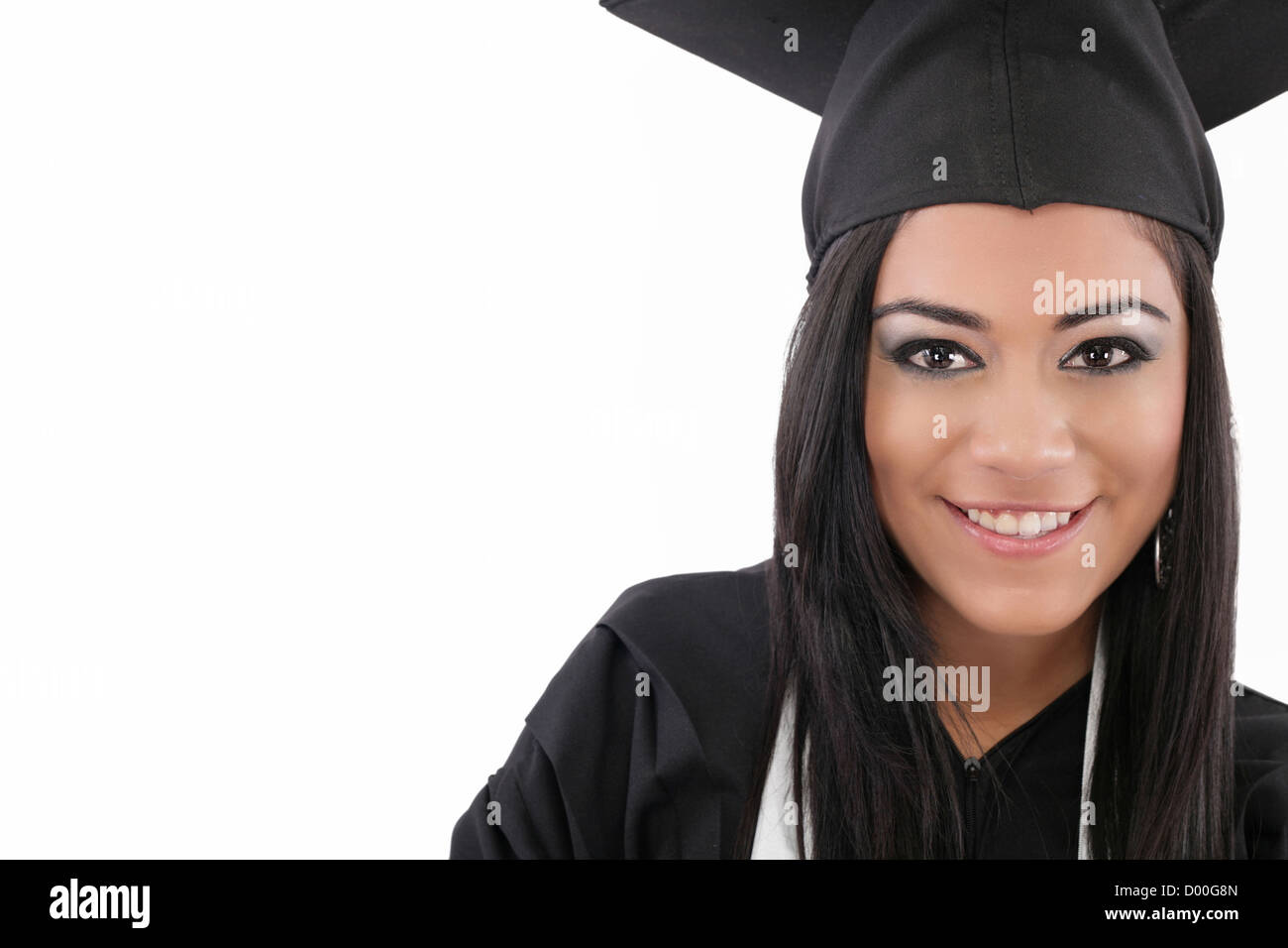 Tema educativo: tesista ragazza in un abito di accademici. Isolato su sfondo bianco. Foto Stock