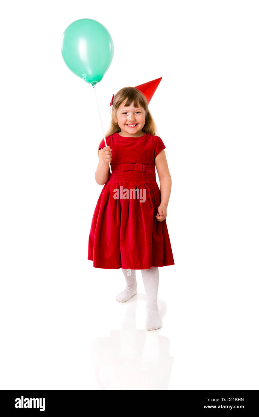 Compleanno bambina indossa trattenimento tappo palloncino isolato su bianco Foto Stock
