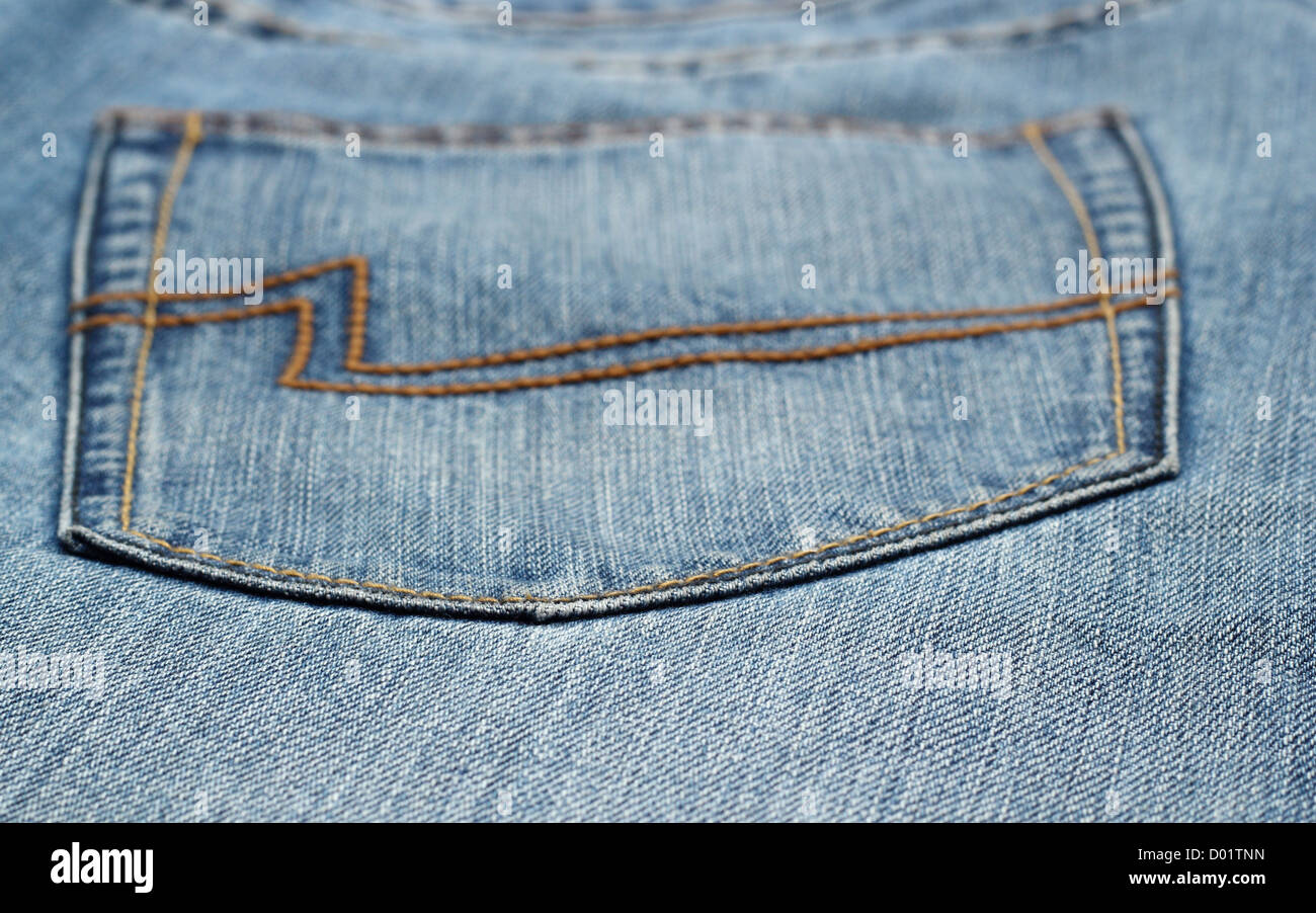 Primo piano della blue jeans pocket - vista astratta dof poco profondo Foto Stock