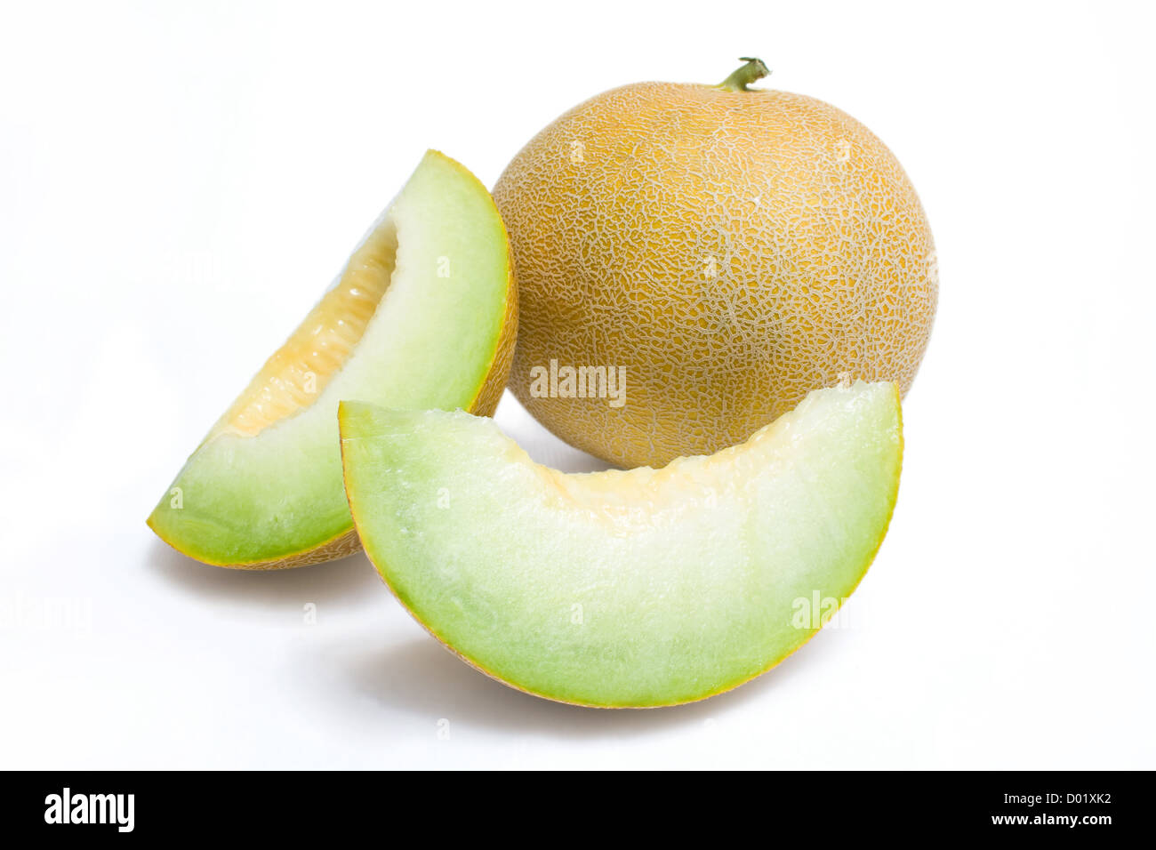 Il melone Honeydew e due fette di melone Foto Stock