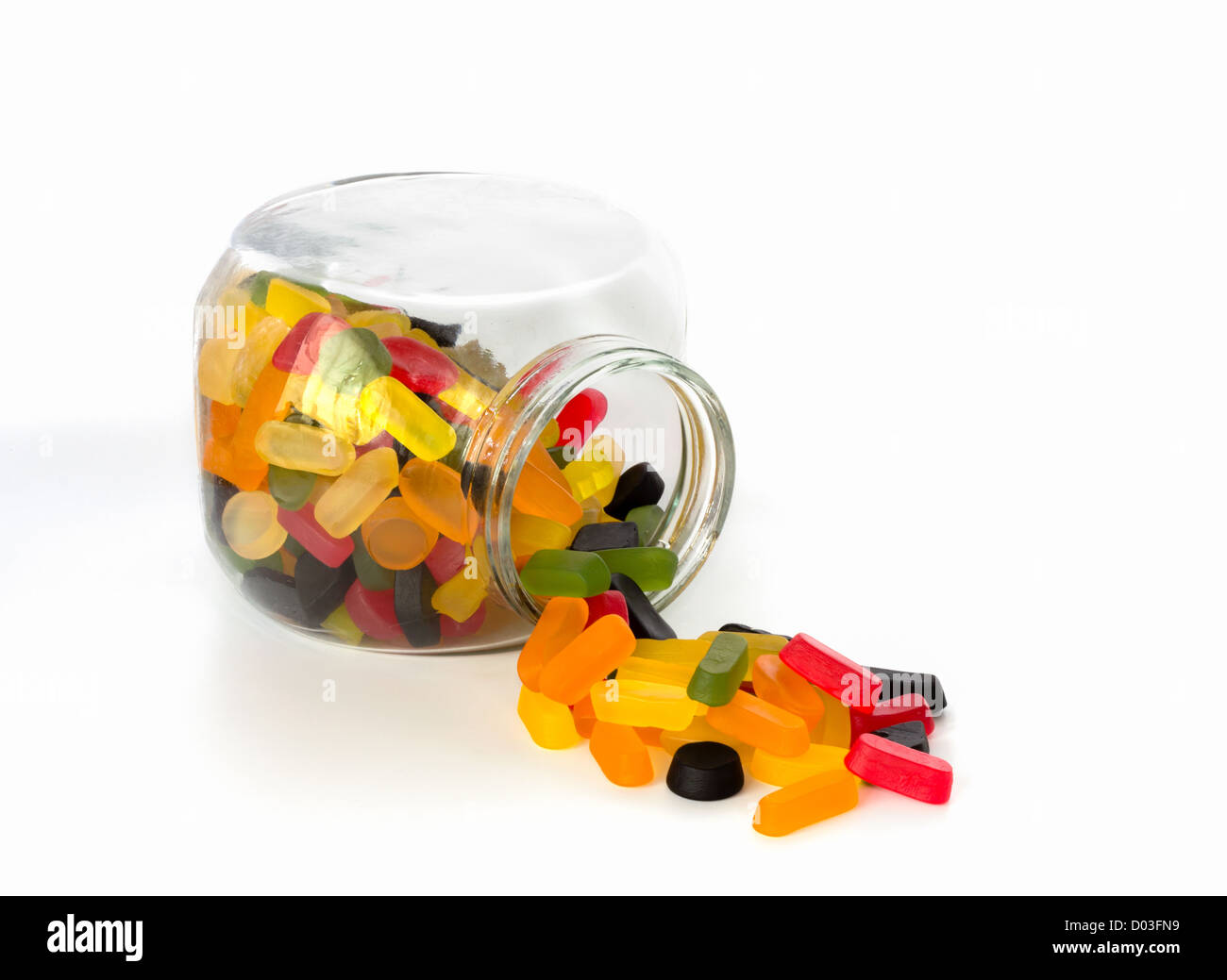 Candy jar fuoriuscite laterali con le gomme di vino gelatina di colore Foto Stock