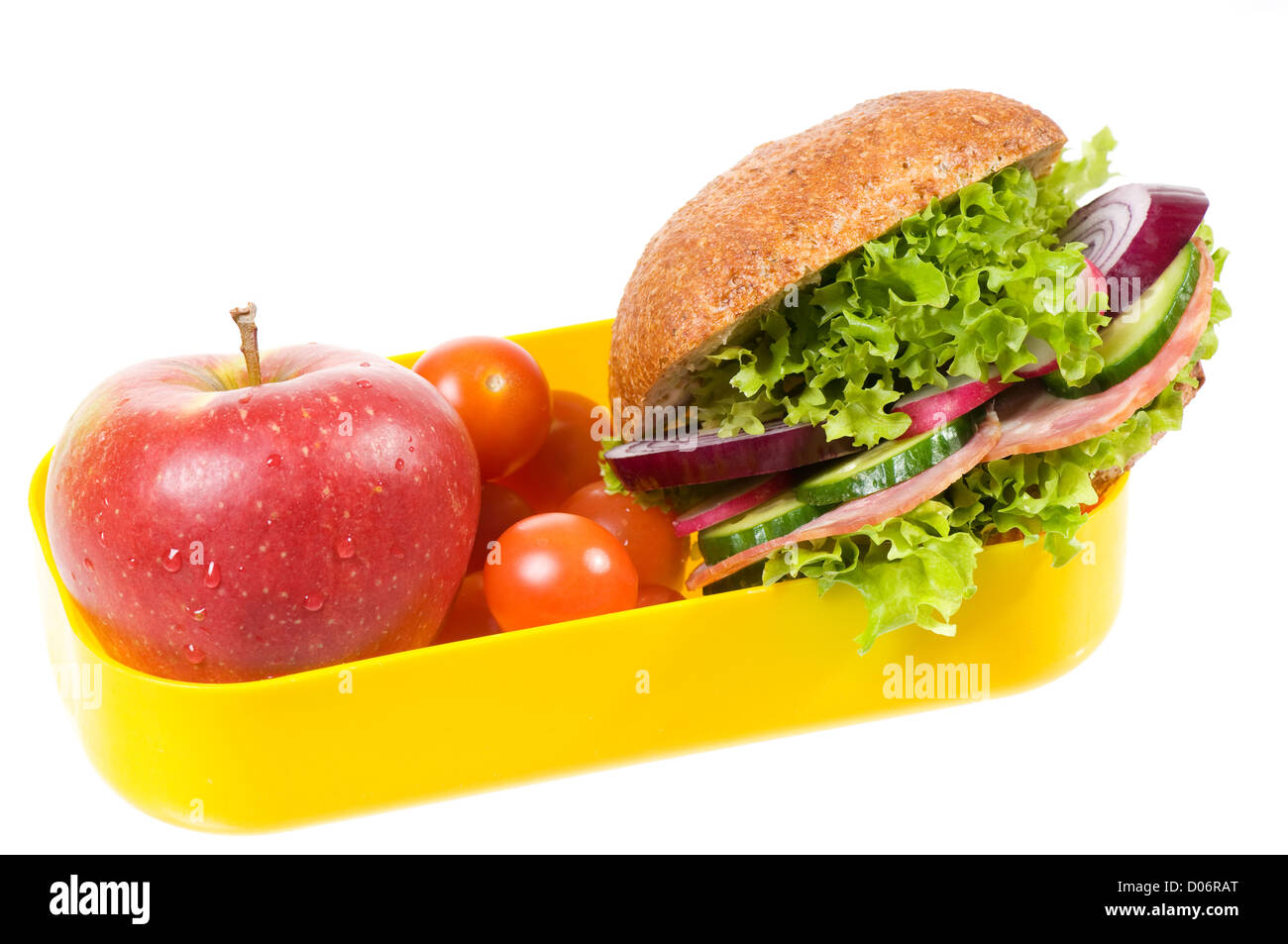Giallo in plastica scatola di pranzo e sandwich con Apple Foto Stock
