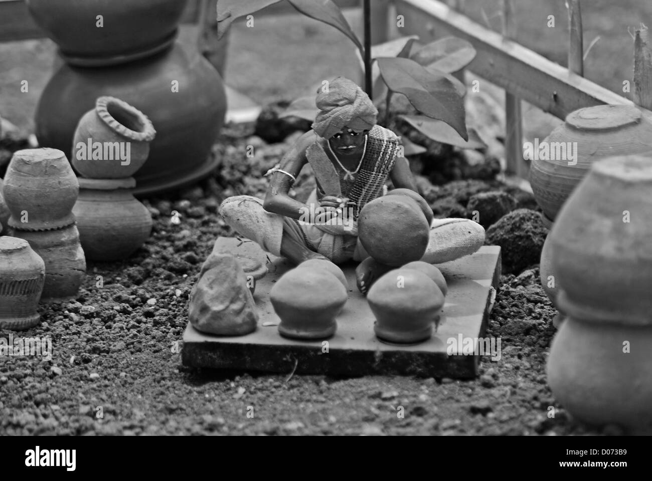 Statua in miniatura di un vasaio, lavoratore Foto Stock