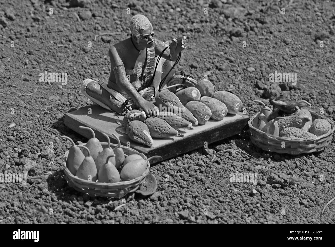 Statua in miniatura di un orto e un venditore di frutta Foto Stock