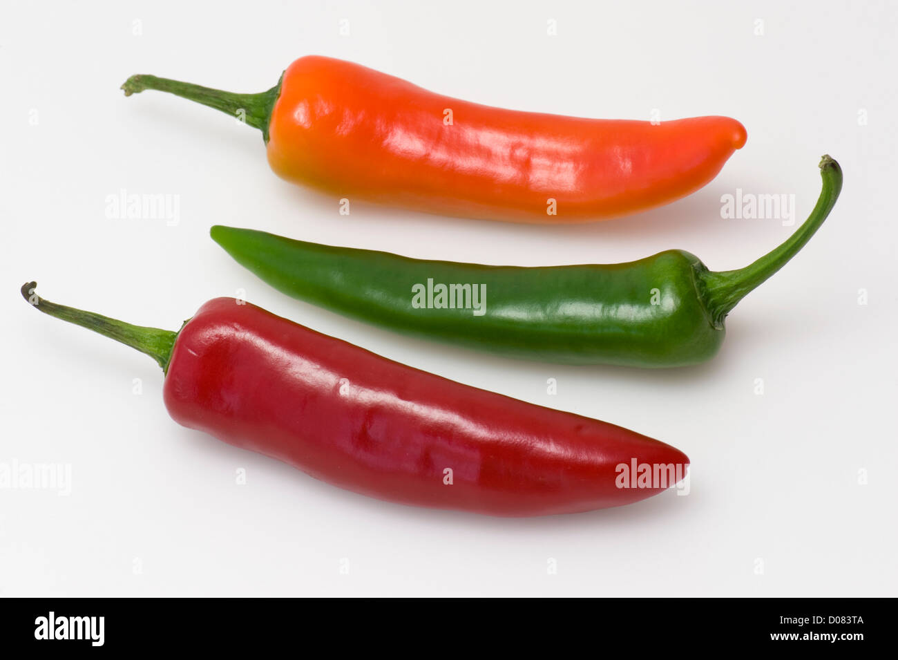 Tre peperoni colorati Foto Stock