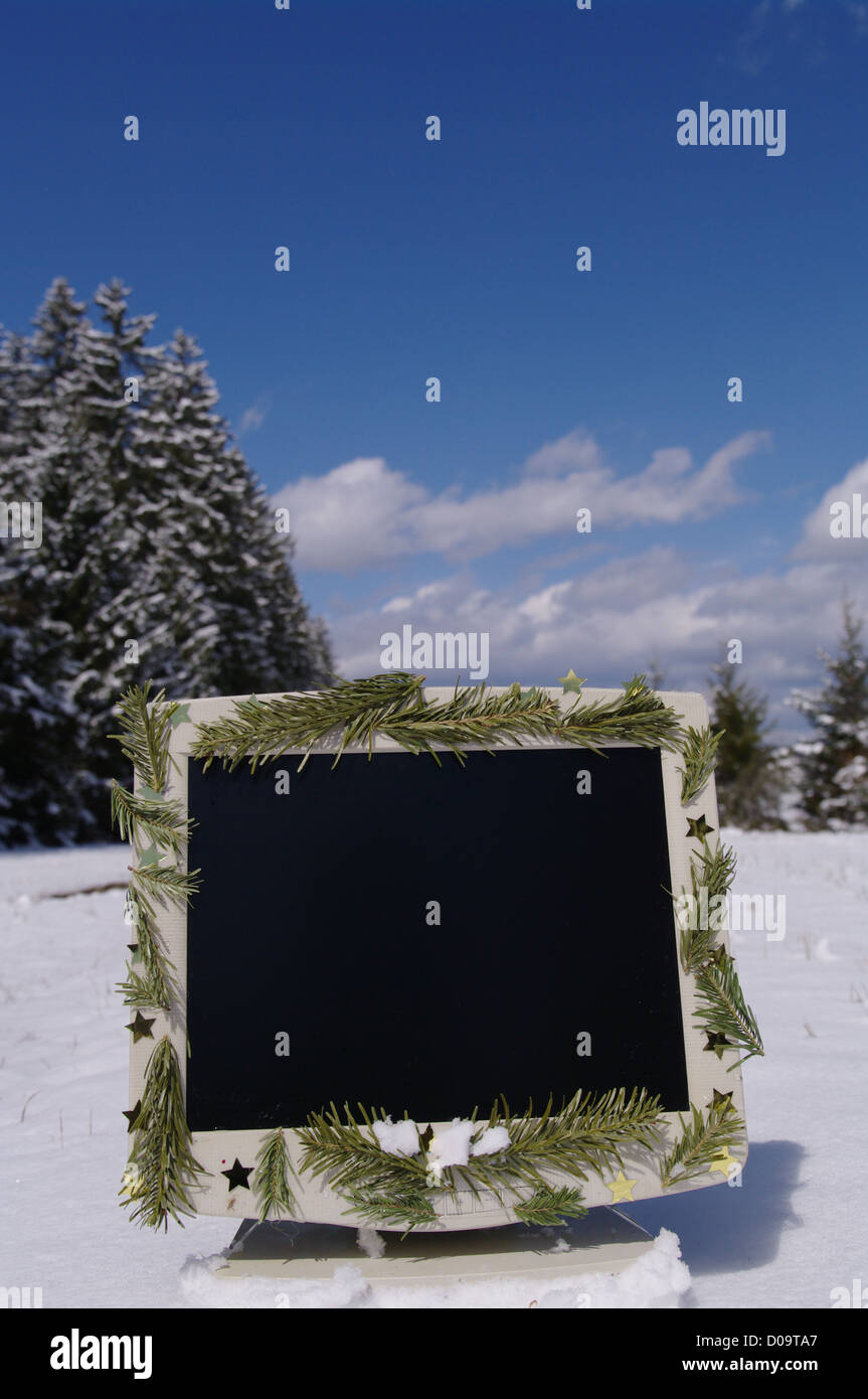 Un decorato schermo nel paesaggio innevato Foto Stock