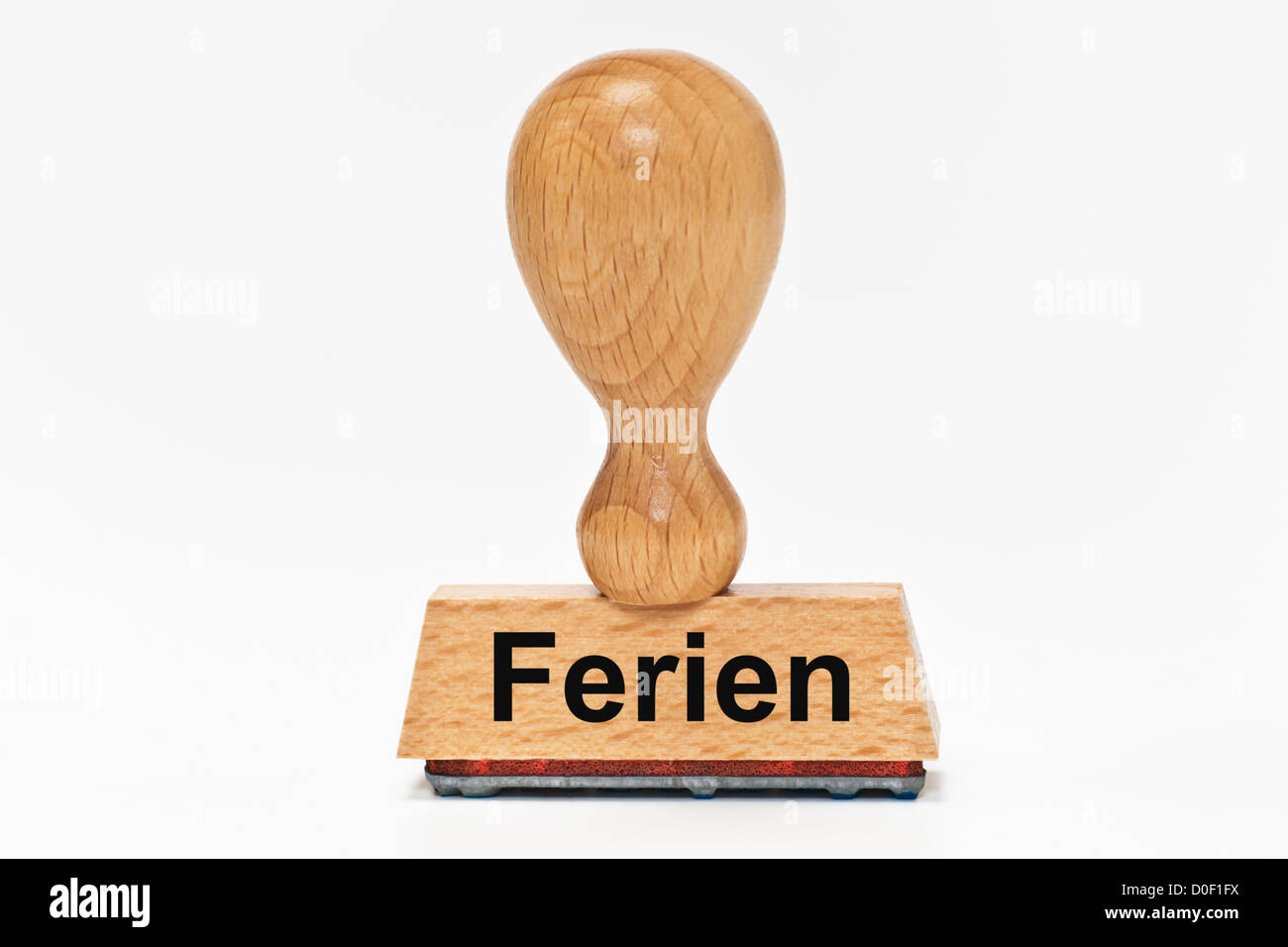 Un francobollo con il tedesco iscrizione Ferien (vacanza) montante, sfondo bianco. Foto Stock