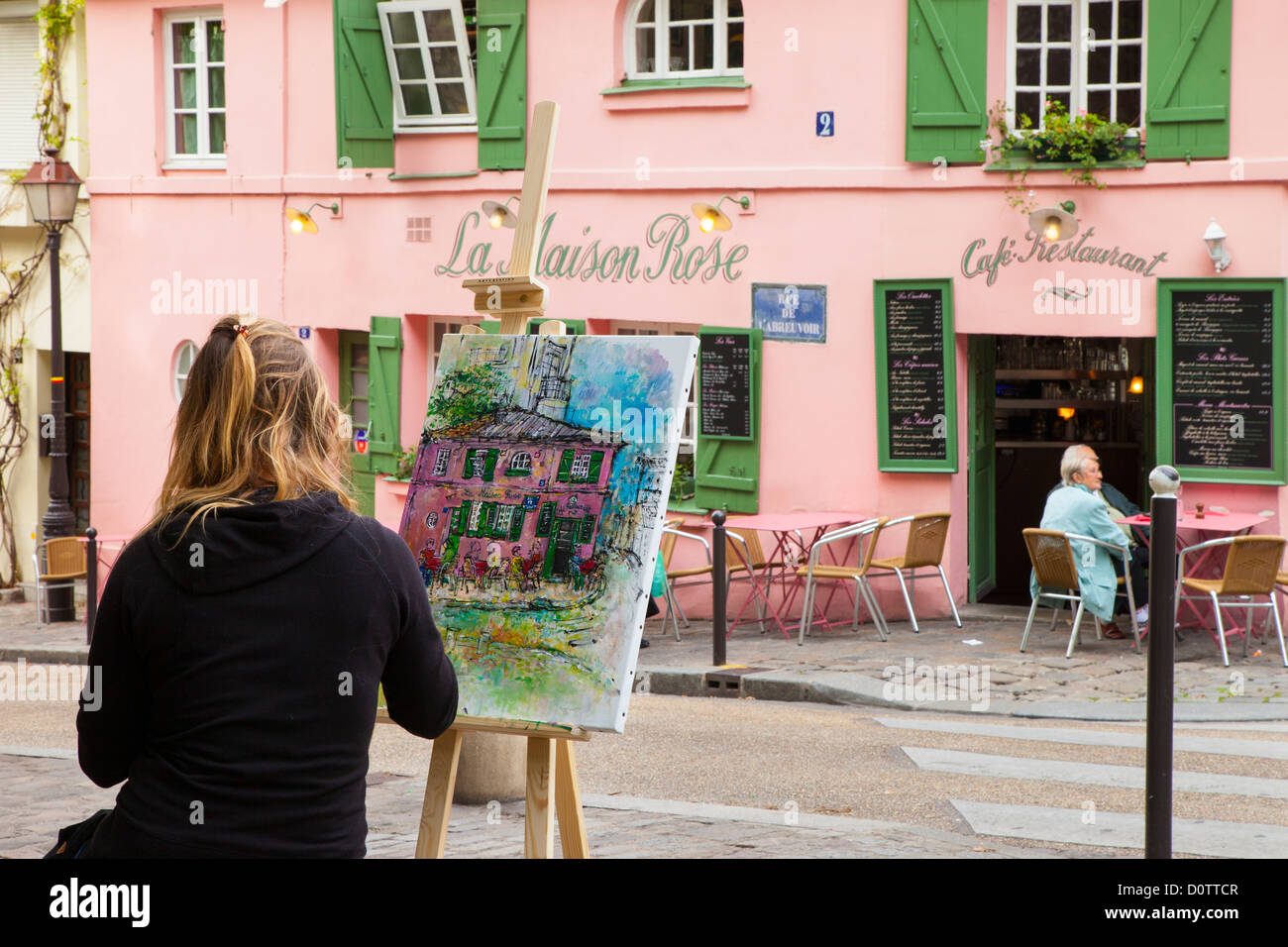 Artista dipinto La Masion Rose cafe di Montmartre, Parigi Francia Foto Stock