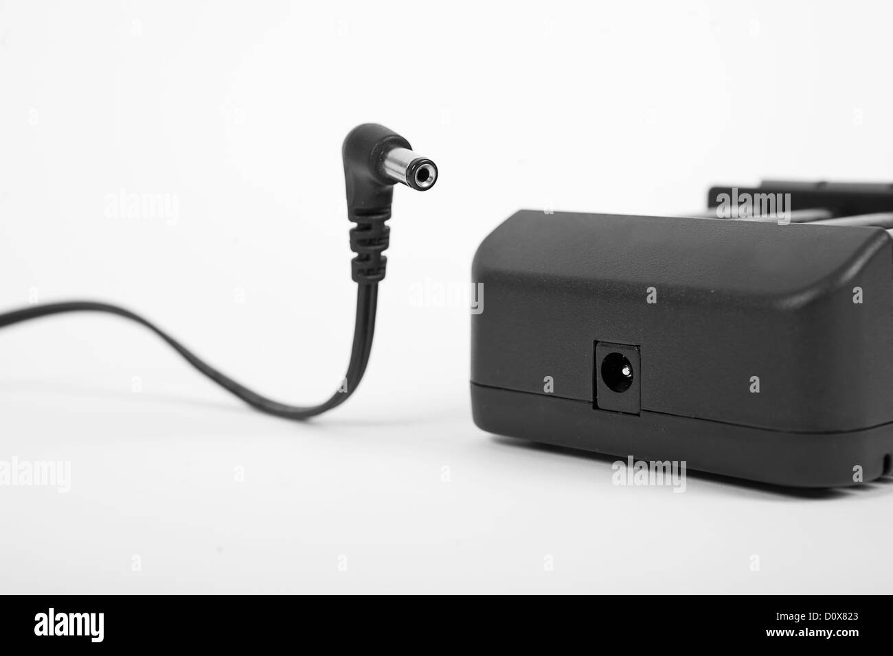 Il tappo e il caricabatterie Foto Stock