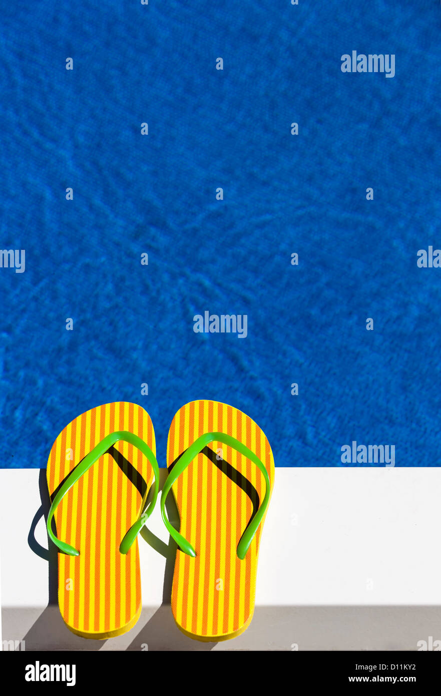 Austria, Linz, Striped flip flop sandles in piscina Foto Stock