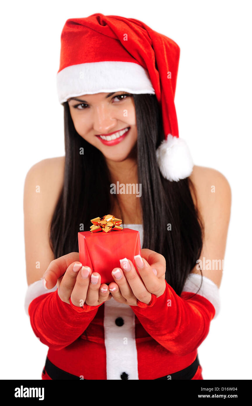 Isolato giovane ragazza di Natale mostra dono Foto Stock