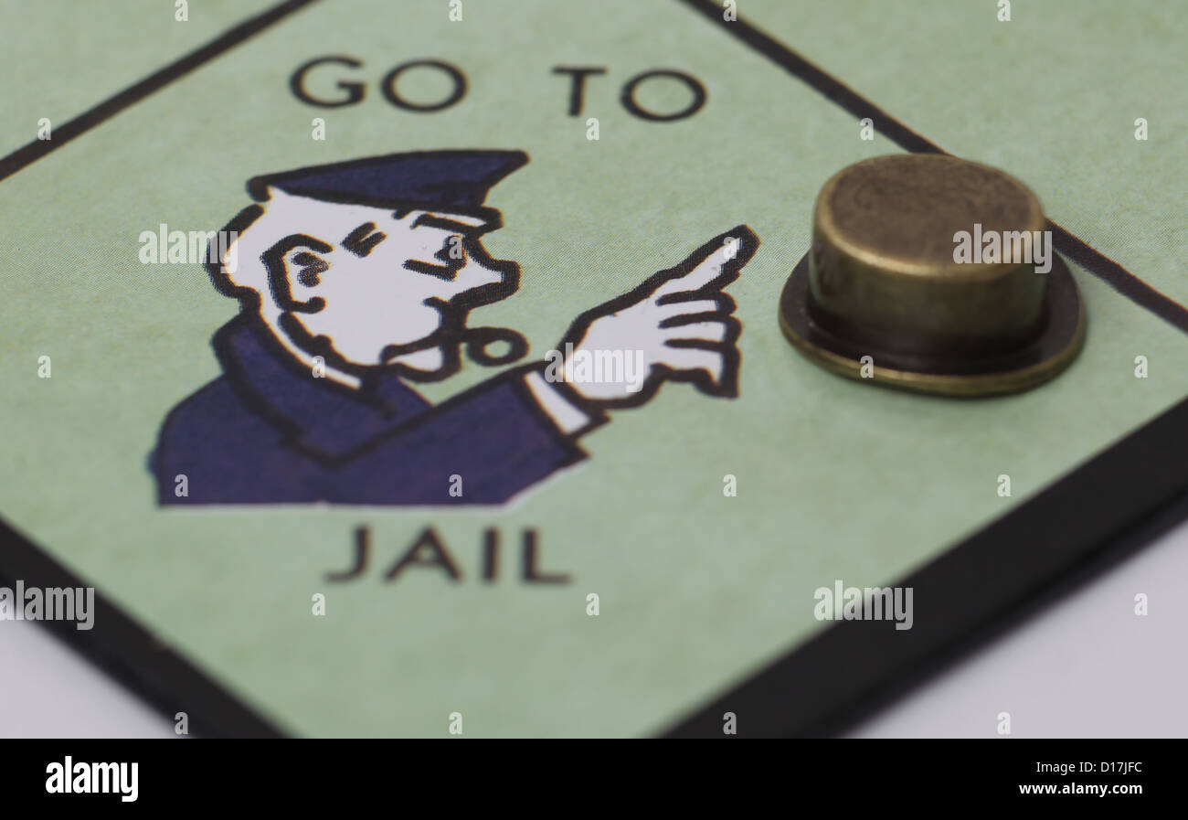 Per andare in prigione quadrato su una scheda di monopolio con Top Hat giocatori pezzo. Foto Stock