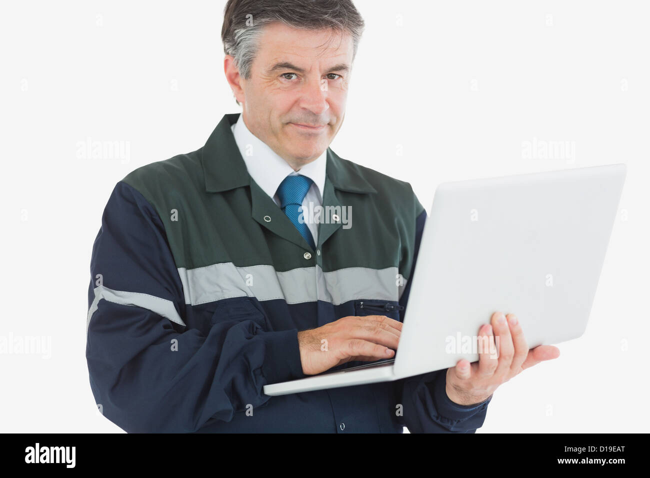 Repairman con il computer portatile Foto Stock