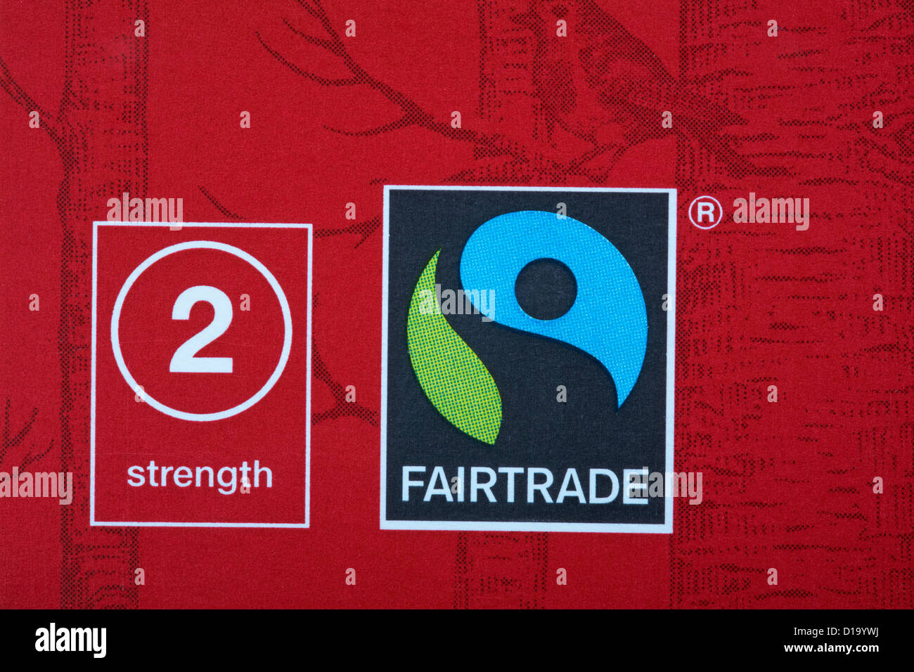 Fairtrade logo e la forza di 2 simboli sulla scatola del tè di Natale - Fairtrade simbolo logo del commercio equo e solidale Foto Stock