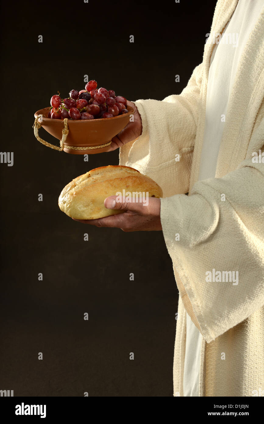 Gesù pane di contenimento e uva simboli della comunione Foto Stock