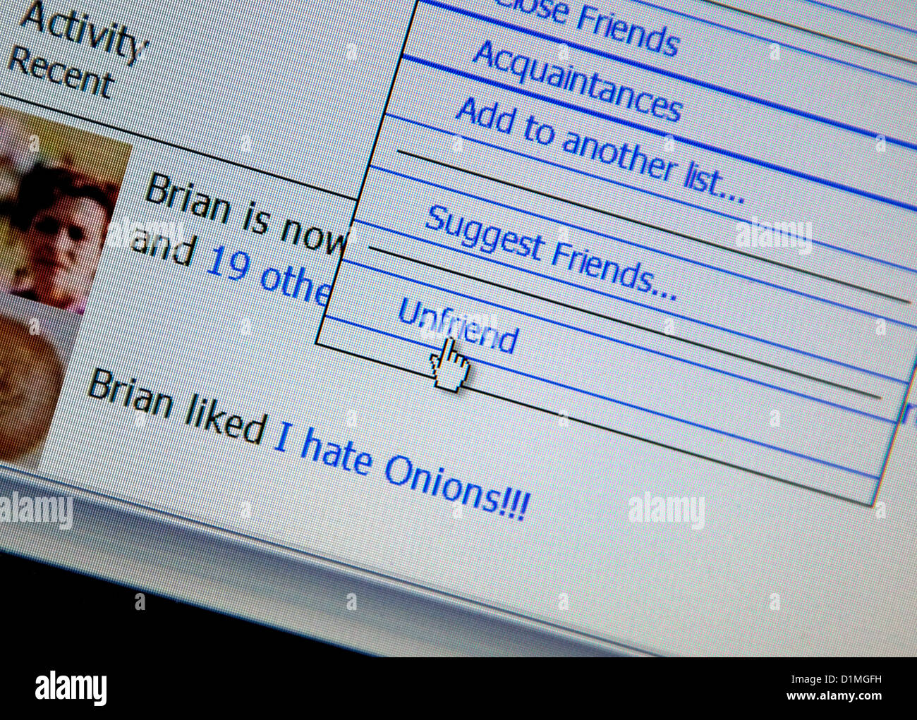 "Unfriend' pulsante sul sito Web di Facebook, Londra Foto Stock