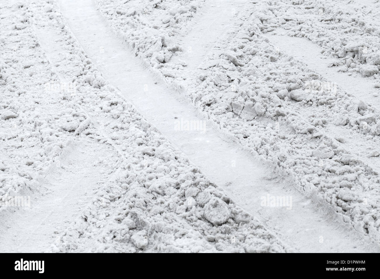 Texture di sfondo della strada coperta di neve bagnata Foto Stock