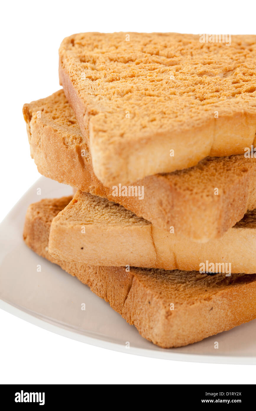 Pane secco su piastra su sfondo bianco Foto Stock