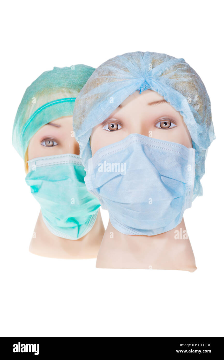 Due donne medico manichino indossare capi tessili cappuccio chirurgica e medica maschera di protezione isolati su sfondo bianco Foto Stock