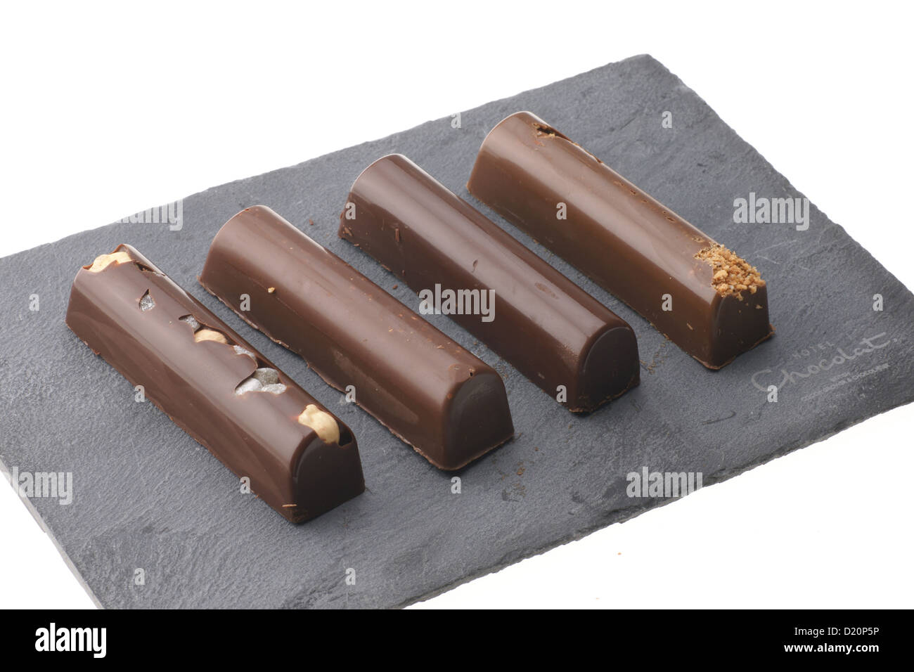Hotel Chocolat, British coltivatore premium e cioccolatiere marca - manganelli venduto con una firma di ardesia solido tagliere. Foto Stock