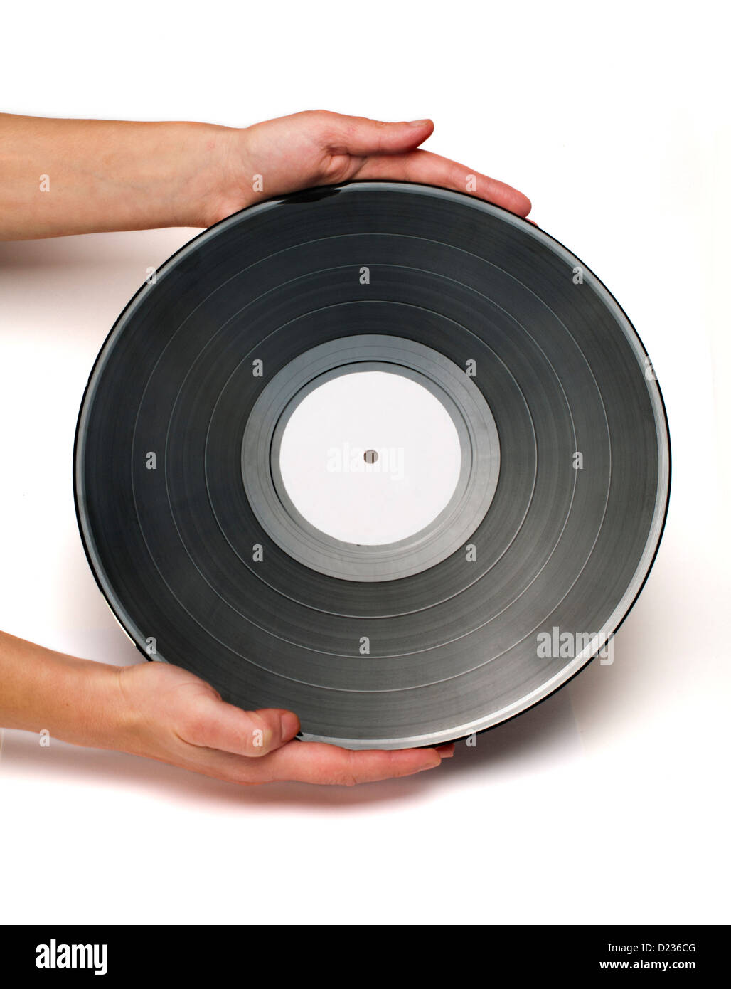 Due mani hanno Vinil Record Isolato bianco. Foto Stock