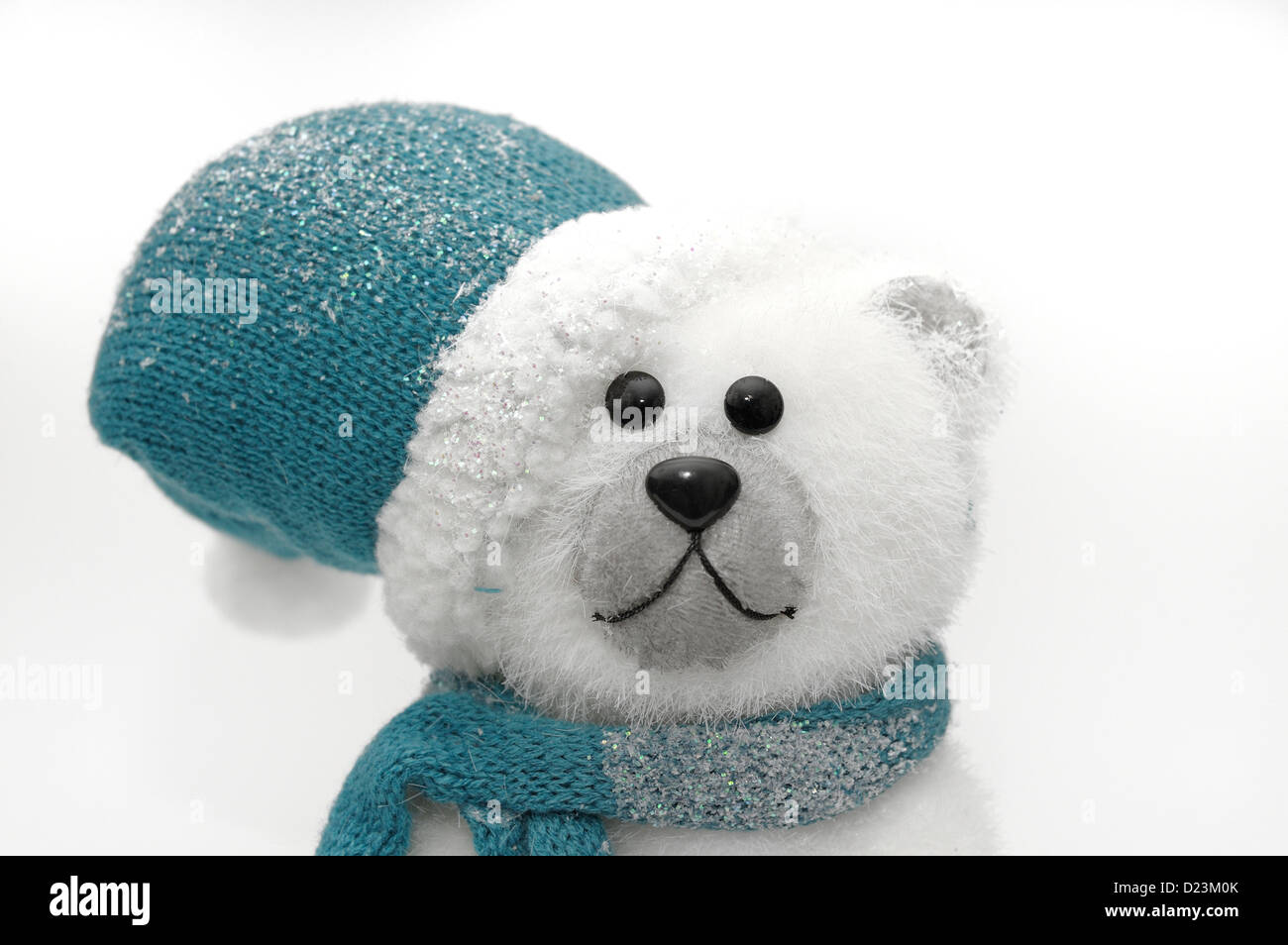 Orso polare in blu cappello e sciarpa Foto Stock