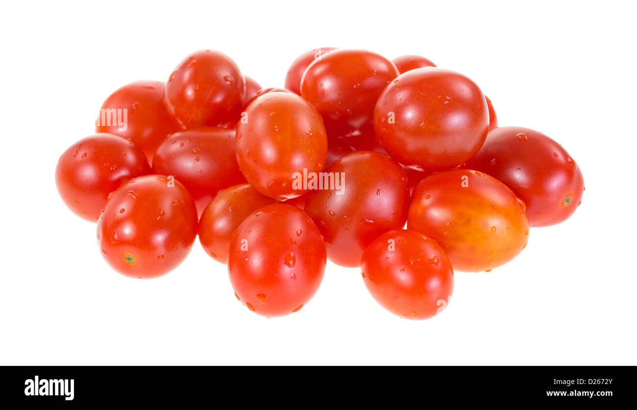 Molti pomodori uva su uno sfondo bianco. Foto Stock
